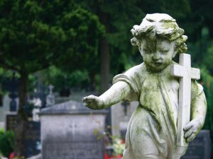 A graveyard statue for the grave of someone who suffered a wrongful death.