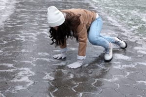 A woman slipping on ice.