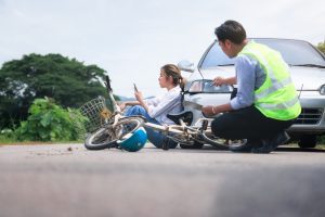 A woman reporting a cycling accident to the police.