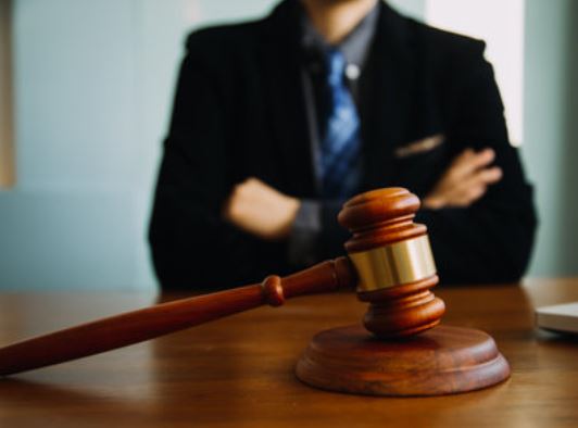 Rape compensation claim solicitor sitting at a desk