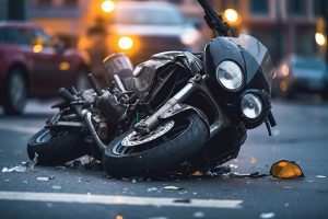 A motorcycle lays upturned in the road.