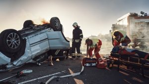 Firefighters attend the scene of a car accident.