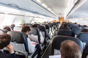 People are sitting on an aircraft. They could have an accident abroad. 