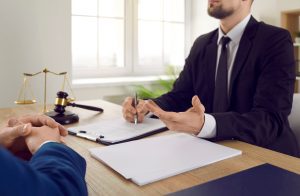 A solicitor, who is an expert in paralysis injury claims, talks to a client.