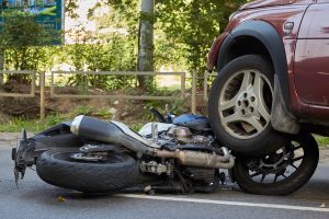 A car and a motorbike have been invloved in a collision.