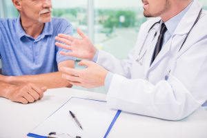 A doctor talks with a patient. 