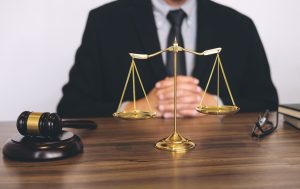 A lawyer who is an expert in emergency services accident claims sits at a desk