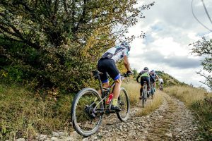 People participate in mountain biking. 