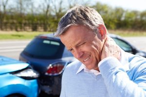 PERSON SUFFERING WHIPLASH AFTER A ROAD TRAFFIC ACCIDENT