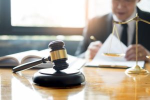 A lawyer who is an expert in prison injury compensation claims sit at his desk.