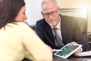 A solicitor shows a client a UK GDPR compensation calculator.