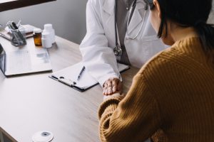 Doctor and patient discussing a cervical cancer misdiagnosis 