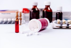 Bottles of medication are on a table. They may have been part of dispensing errors.