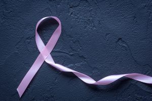 A pink ribbon showing support for those with cancer 