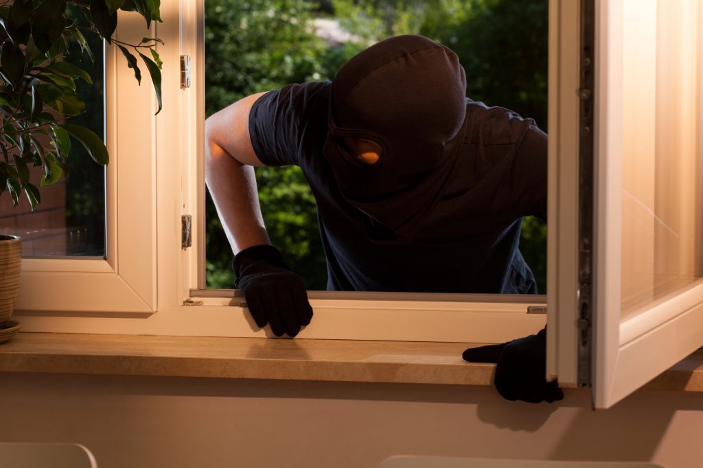 Man breaking into a house